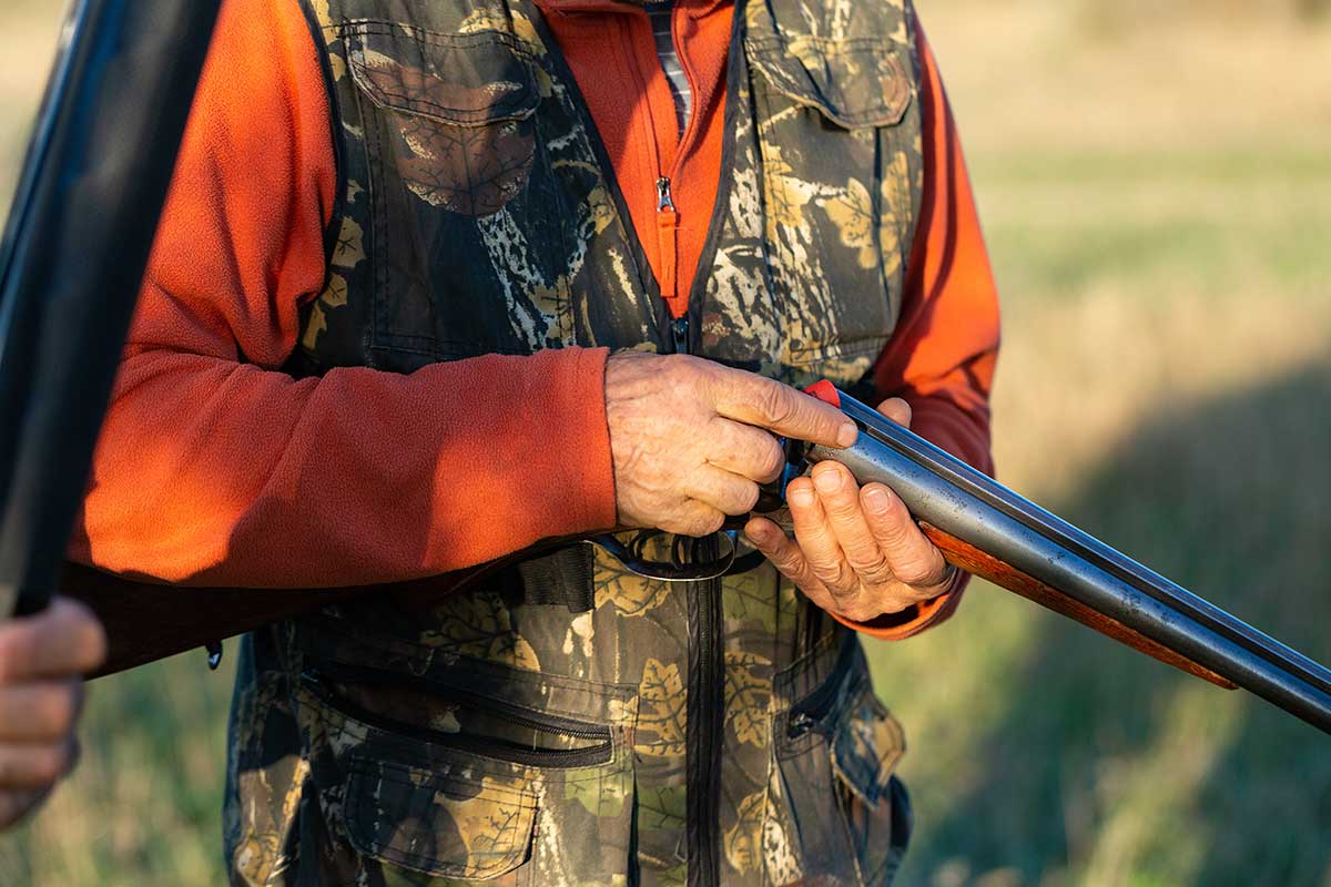 mature hunter with a gun for hunting